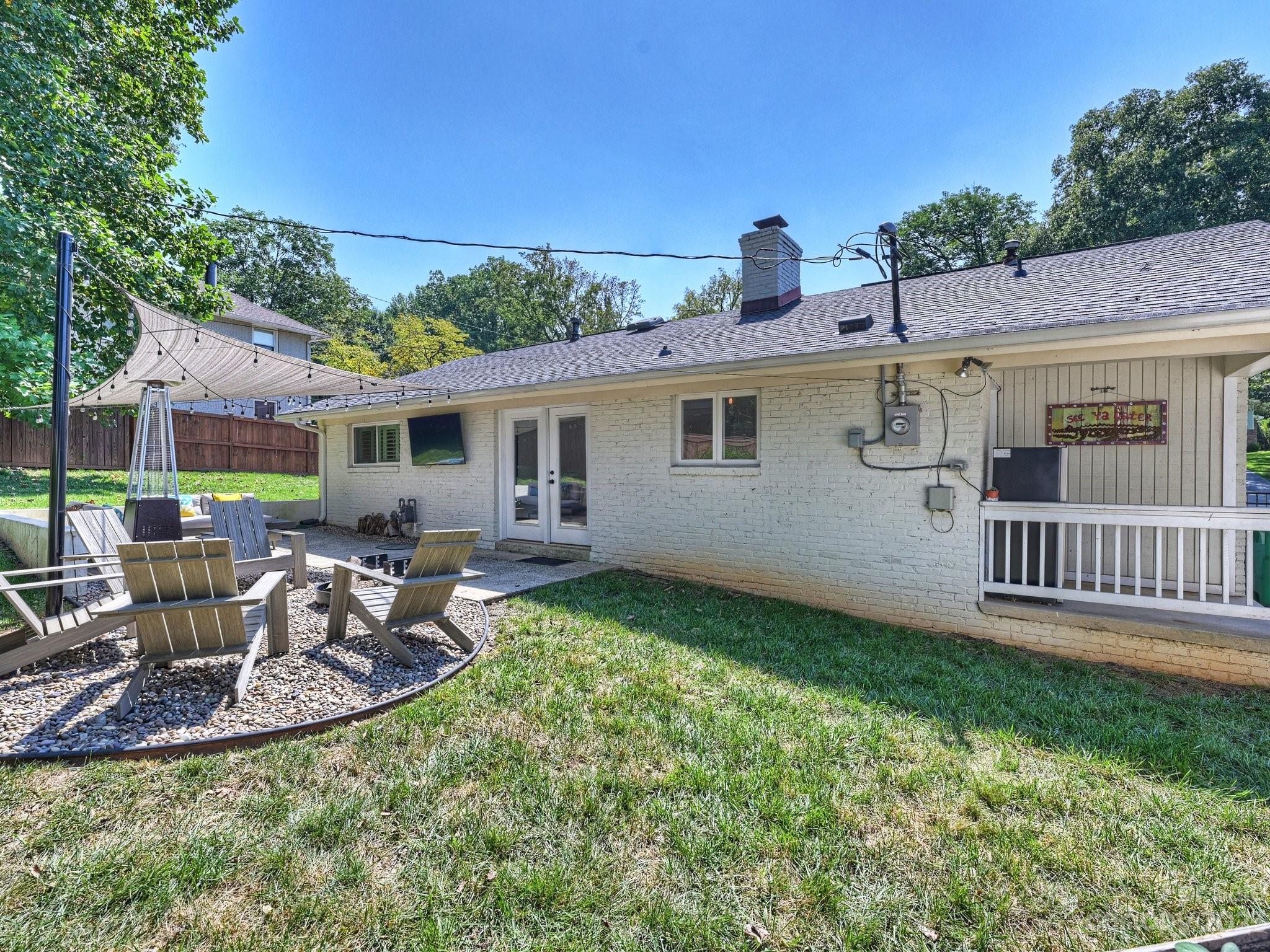 101 Scofield Road Charlotte, NC 28209 - Photo 24 of 26 a view of a house with backyard and sitting area