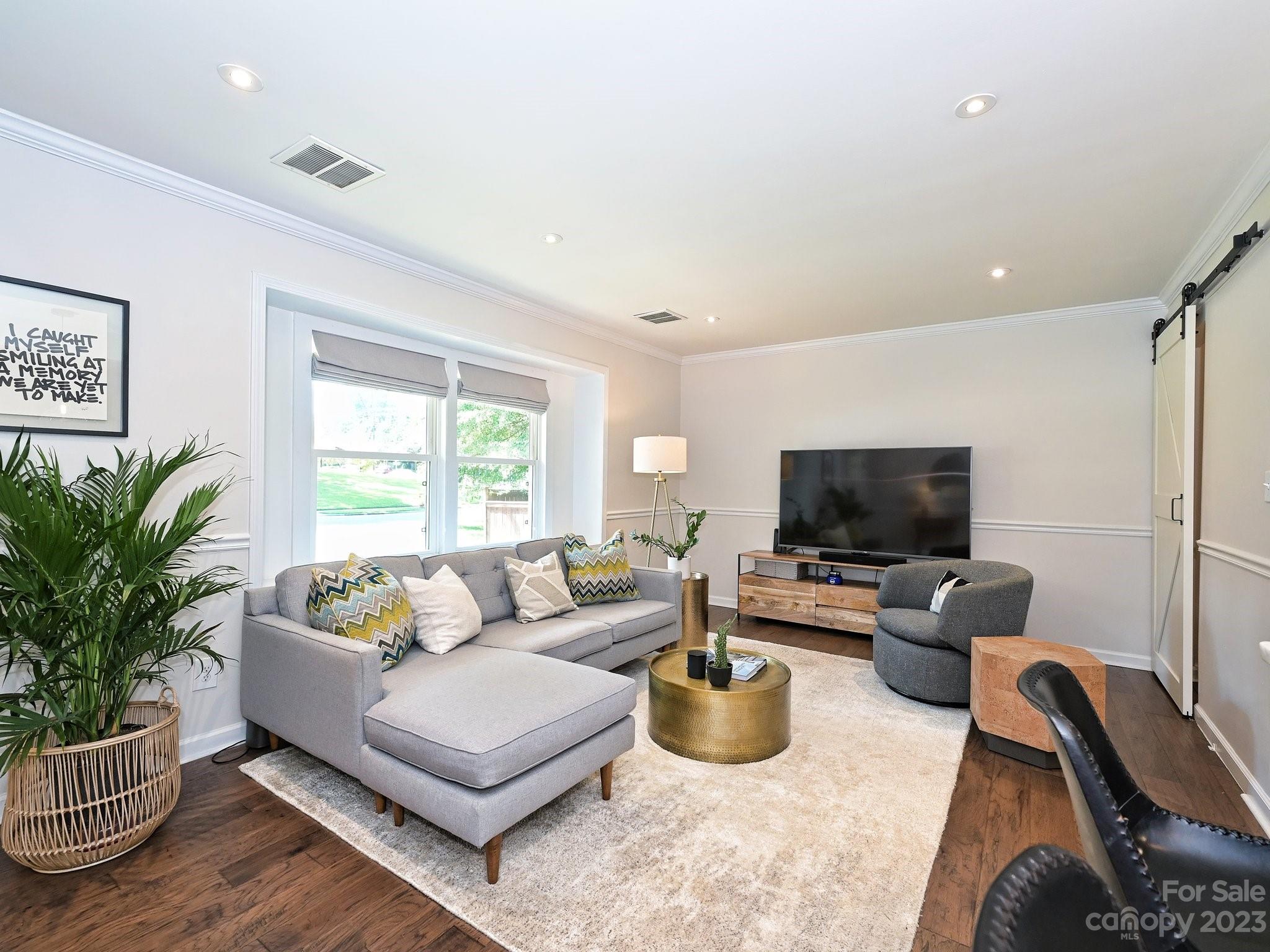 101 Scofield Road Charlotte, NC 28209 - Photo 5 of 26 a living room with furniture and a flat screen tv