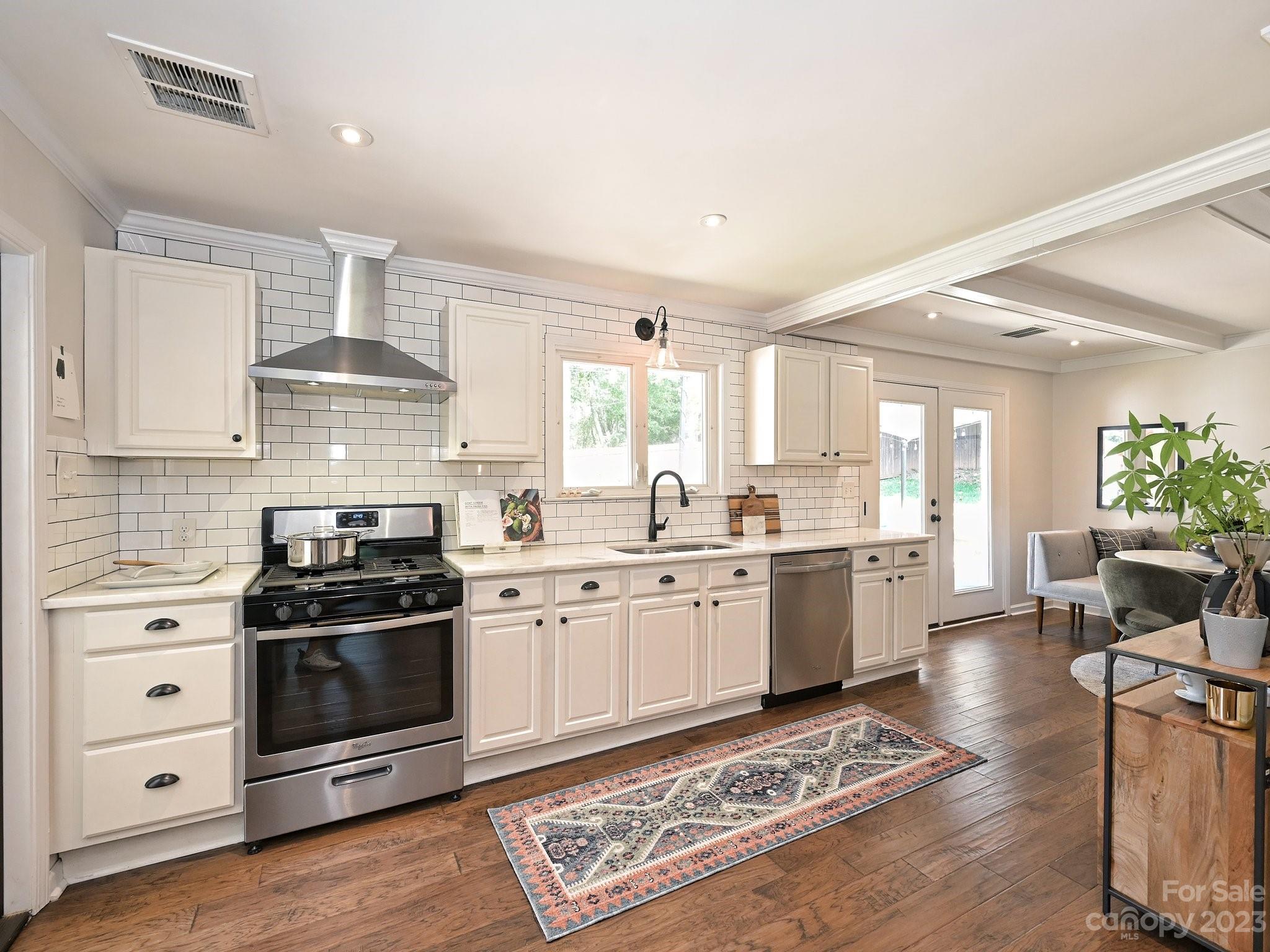 101 Scofield Road Charlotte, NC 28209 - Photo 7 of 26 a kitchen with granite countertop appliances cabinets and a wooden floor