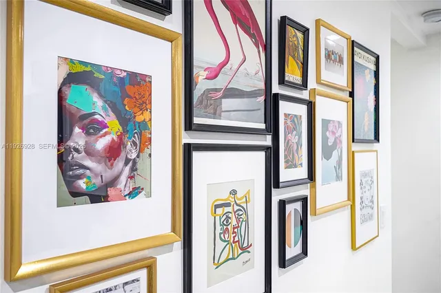 a view of a door with a painting on the wall