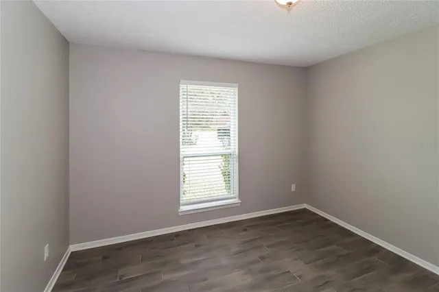 wooden floor and window in an empty room