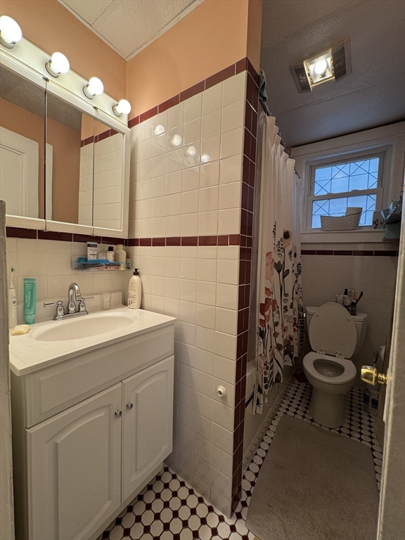 5 Spring Park Avenue, Unit 1 Boston, MA 02130 - Photo 16 of 24 a bathroom with a sink a toilet and shower