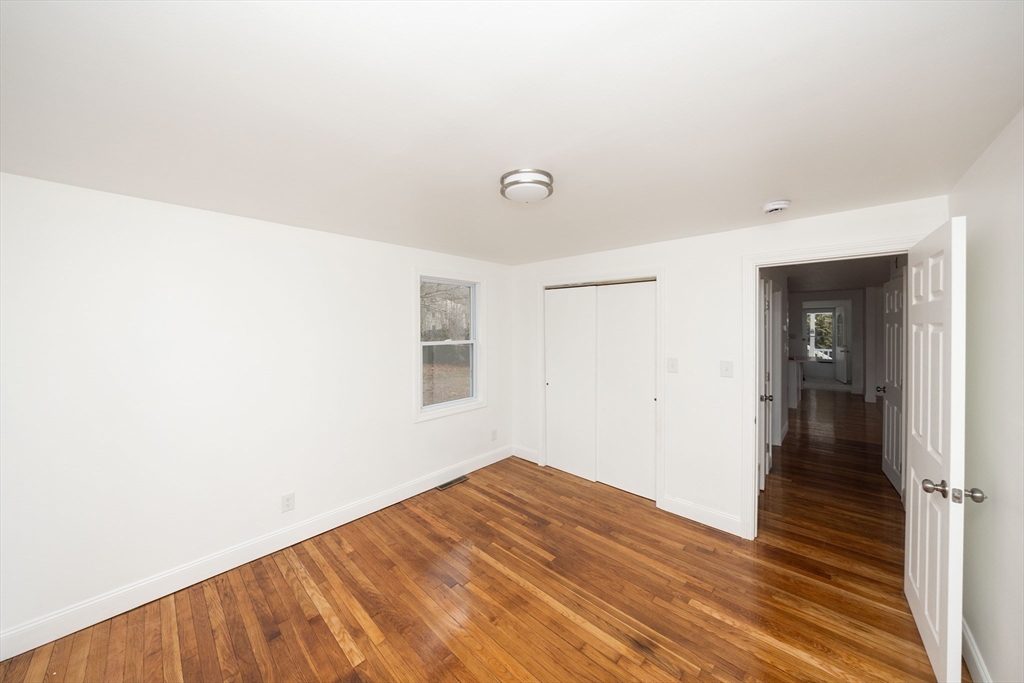155 Southbridge Road Oxford, MA 01537 - Photo 19 of 42 a view of a room with wooden floor and a ceiling fan