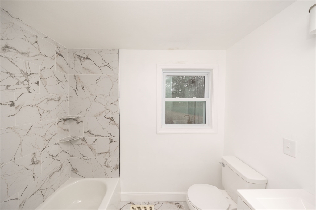 155 Southbridge Road Oxford, MA 01537 - Photo 20 of 42 a bathroom with a toilet and a bathtub