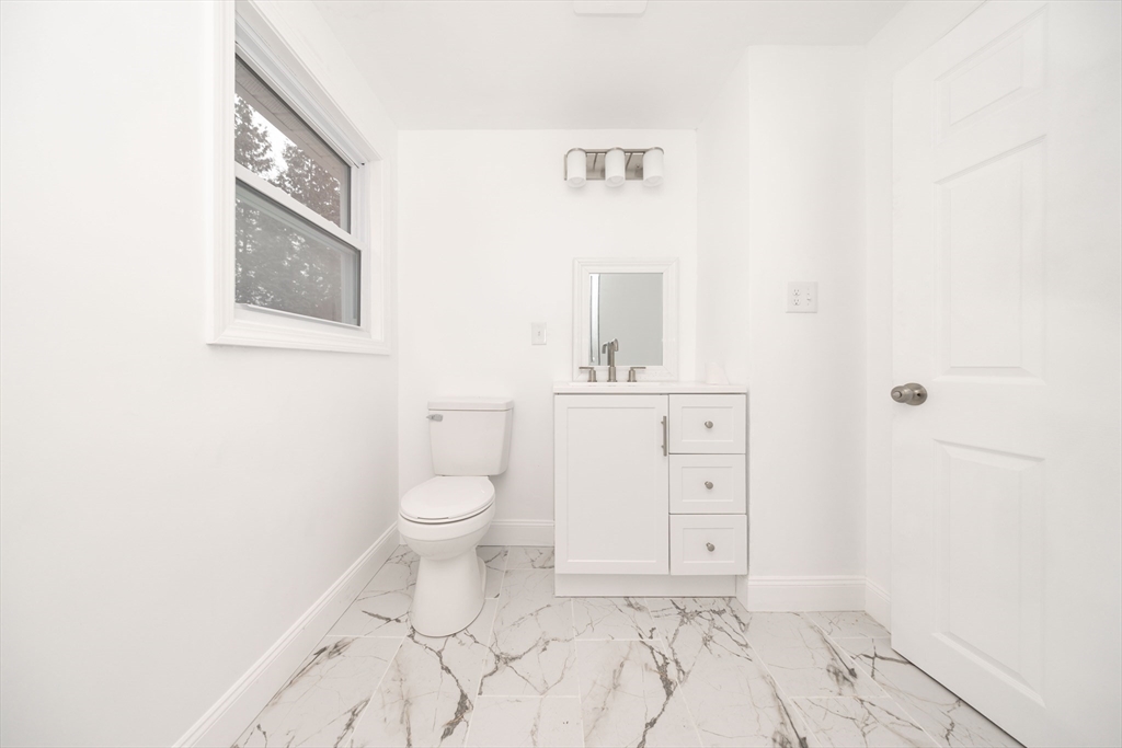 155 Southbridge Road Oxford, MA 01537 - Photo 22 of 42 a bathroom with a toilet sink and mirror
