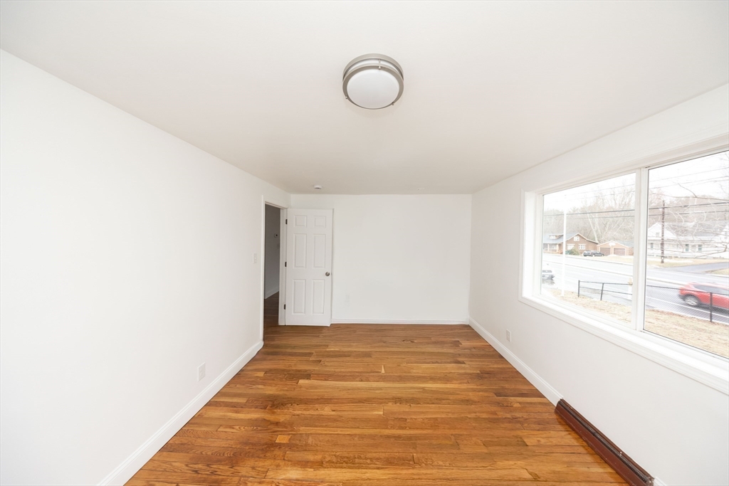 155 Southbridge Road Oxford, MA 01537 - Photo 28 of 42 a view of a room with wooden floor and window