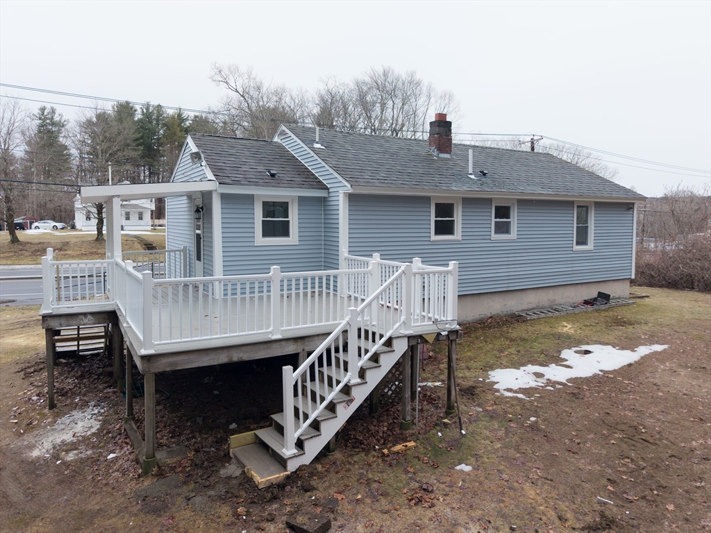 155 Southbridge Road Oxford, MA 01537 - Photo 37 of 42 a view of a house with a wooden deck