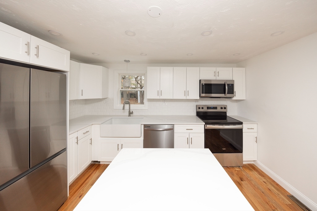 155 Southbridge Road Oxford, MA 01537 - Photo 4 of 42 a kitchen with a refrigerator stove and microwave