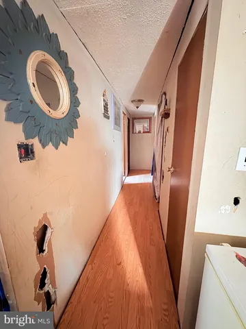 a view of a dining room with furniture and a chandelier