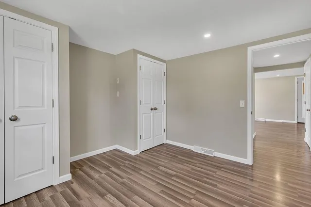 a bathroom with a toilet sink and vanity