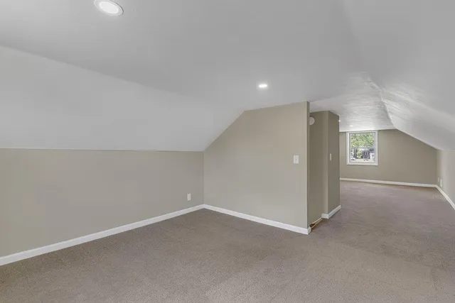 a view of water heater room with stairs