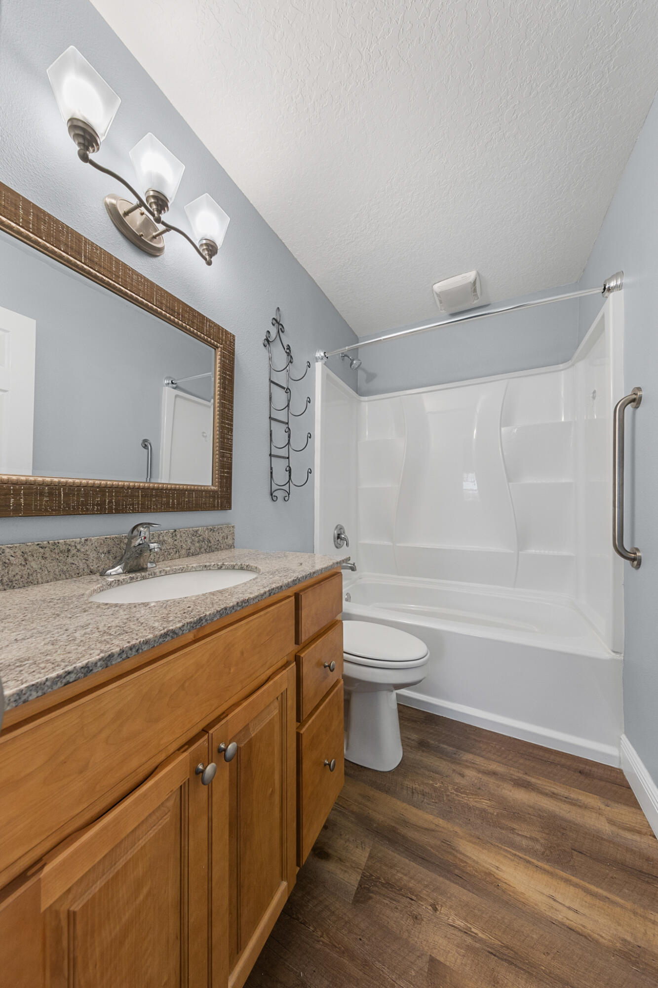 1972 Post Road Melbourne, FL 32935 - Photo 12 of 21 a bathroom with a granite countertop sink mirror vanity and toilet