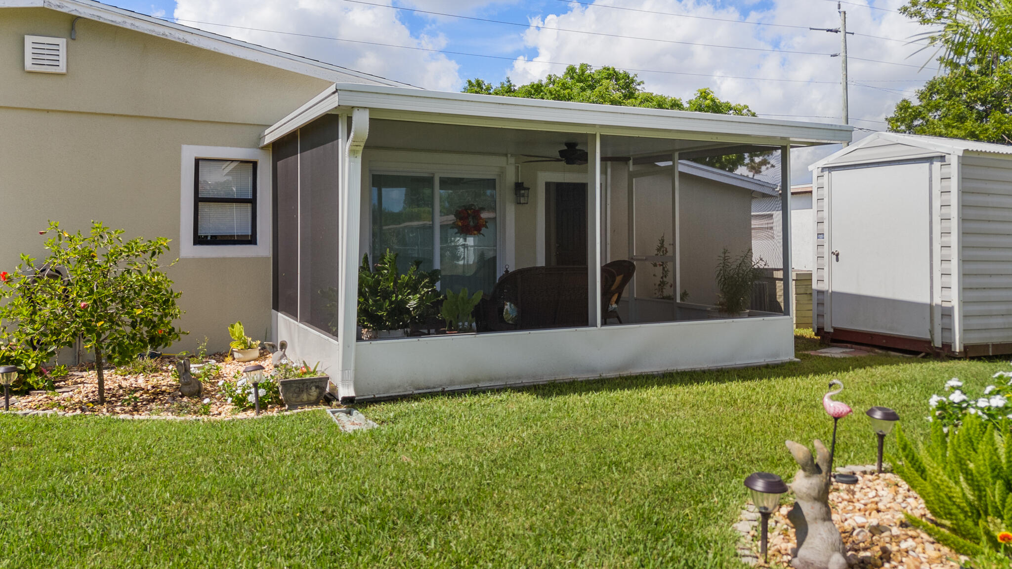 1972 Post Road Melbourne, FL 32935 - Photo 16 of 21 a front view of a house with garden