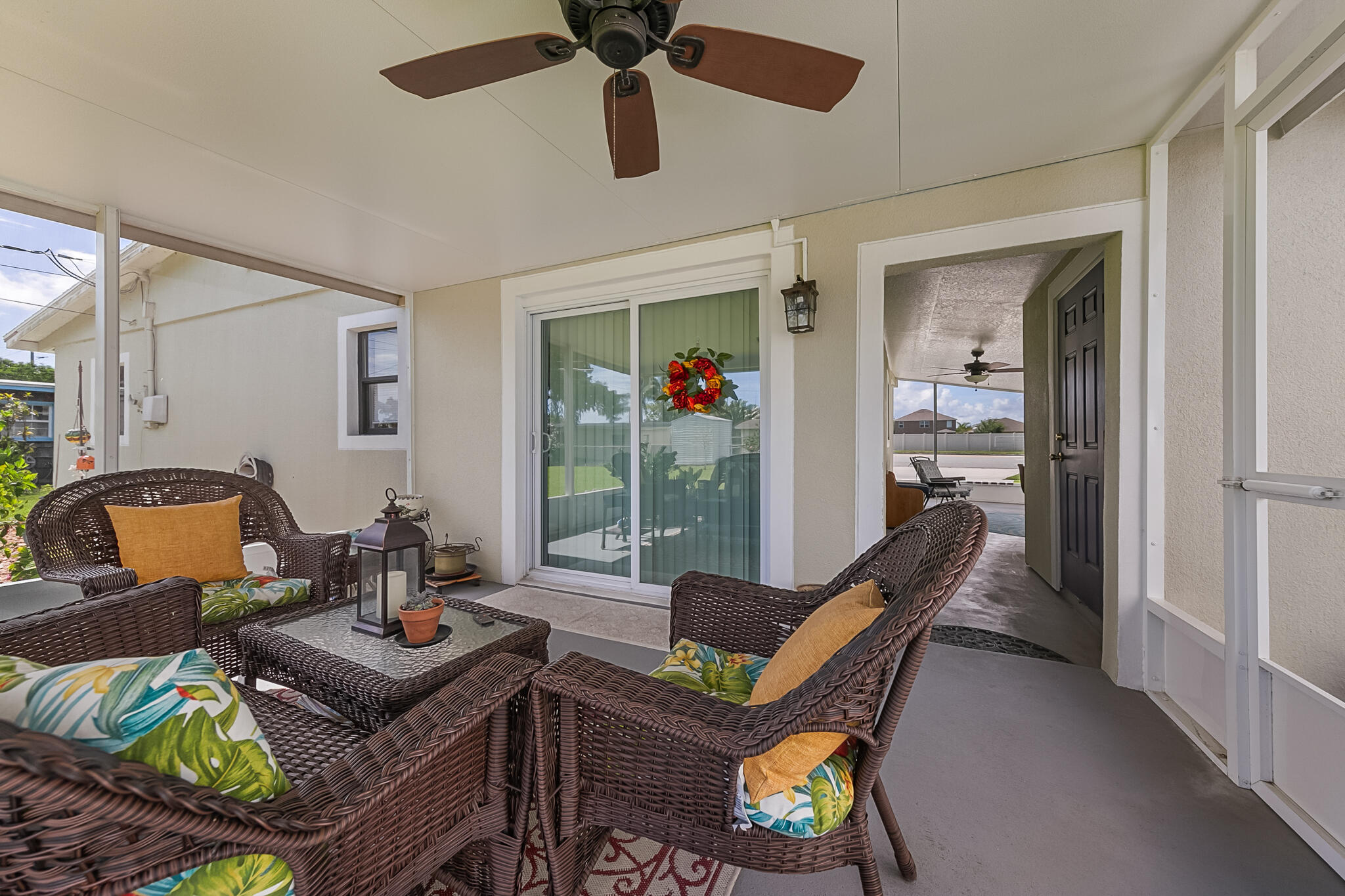 1972 Post Road Melbourne, FL 32935 - Photo 20 of 21 a living room with furniture a rug and a chandelier