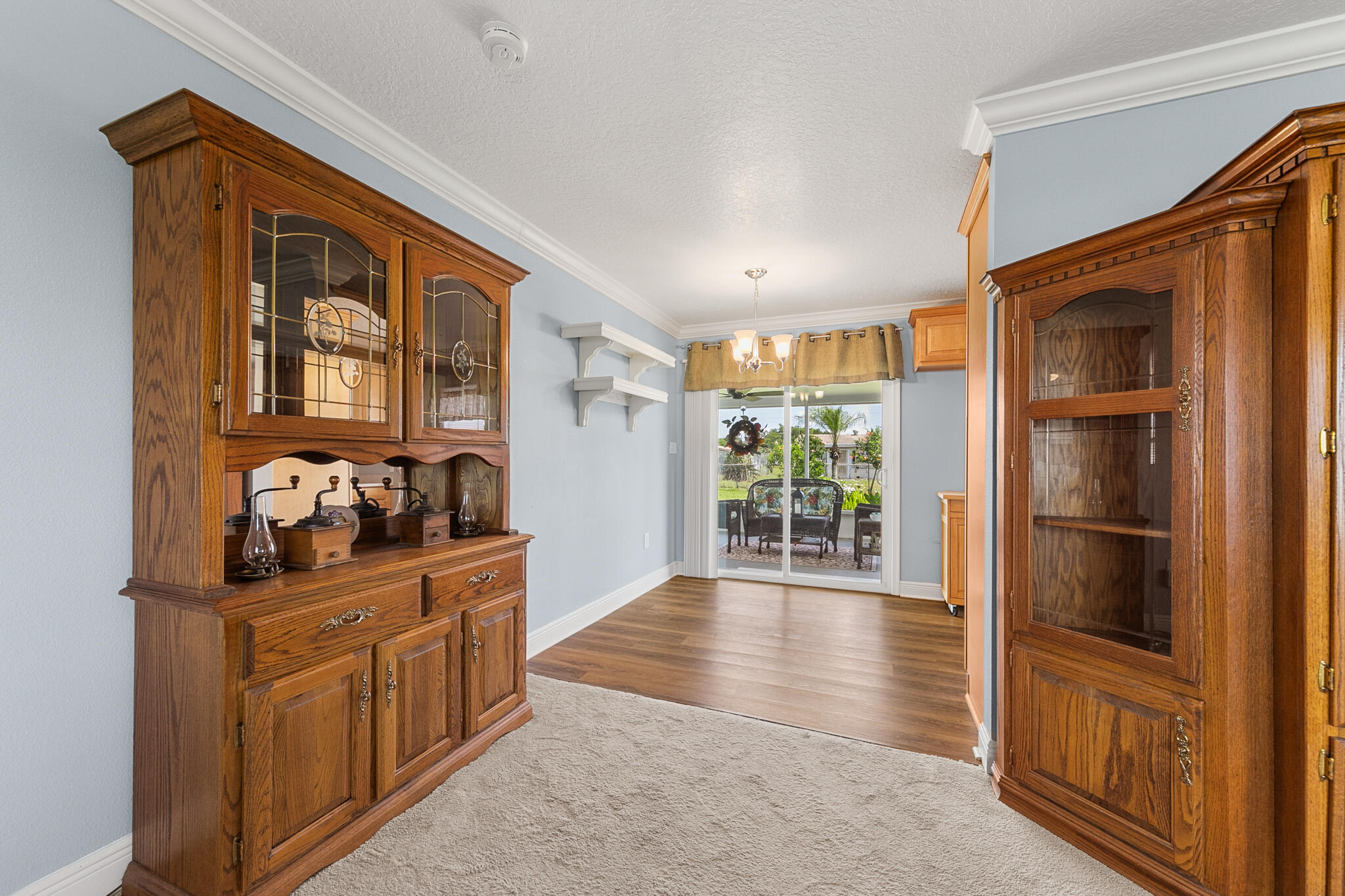 1972 Post Road Melbourne, FL 32935 - Photo 5 of 21 a hallway with cabinets and wooden floor