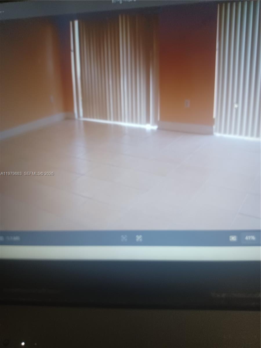 12838 Southwest 256th Terrace Homestead, FL 33032 - Photo 3 of 4 a room that has a window