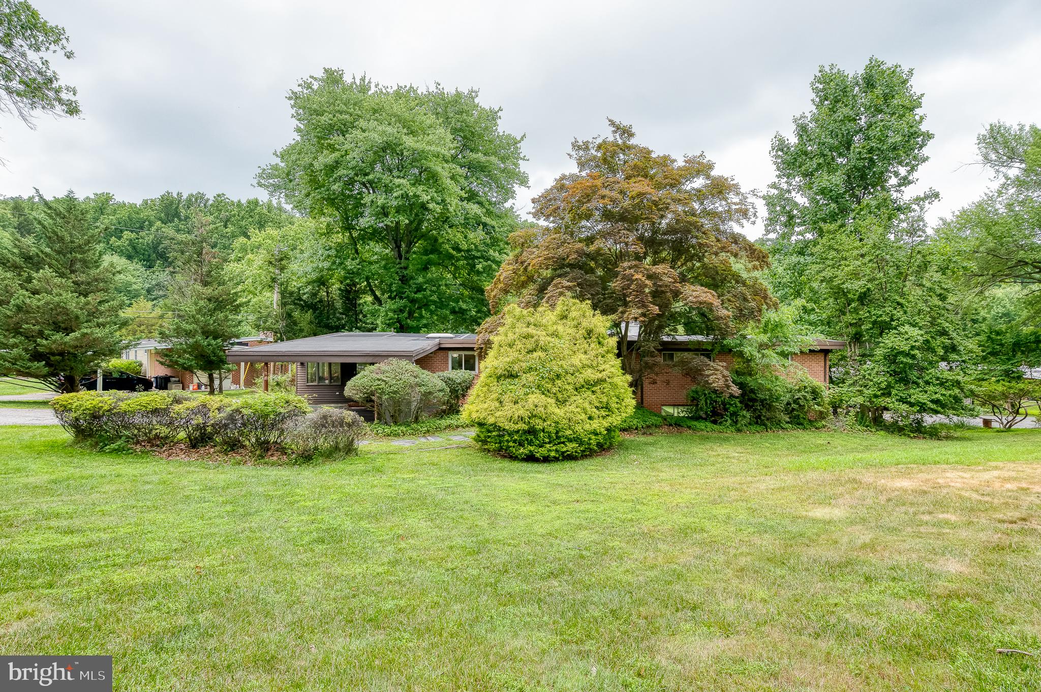 3228 Midfield Road Pikesville, MD 21208 - Photo 1 of 42 Charming home amid lush greenery.
