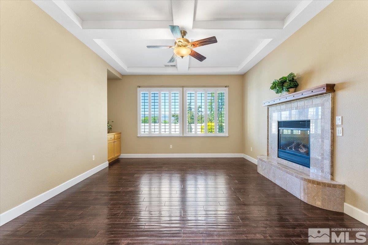 10145 Burghley Lane Reno, NV 89521 - Photo 13 of 31 wooden floor in an empty room with a window
