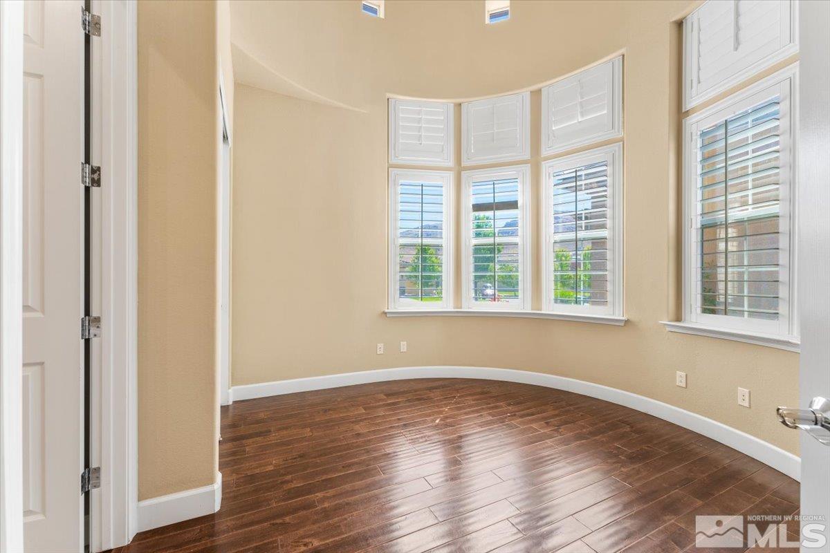 10145 Burghley Lane Reno, NV 89521 - Photo 20 of 31 a view of wooden floor and windows in a room