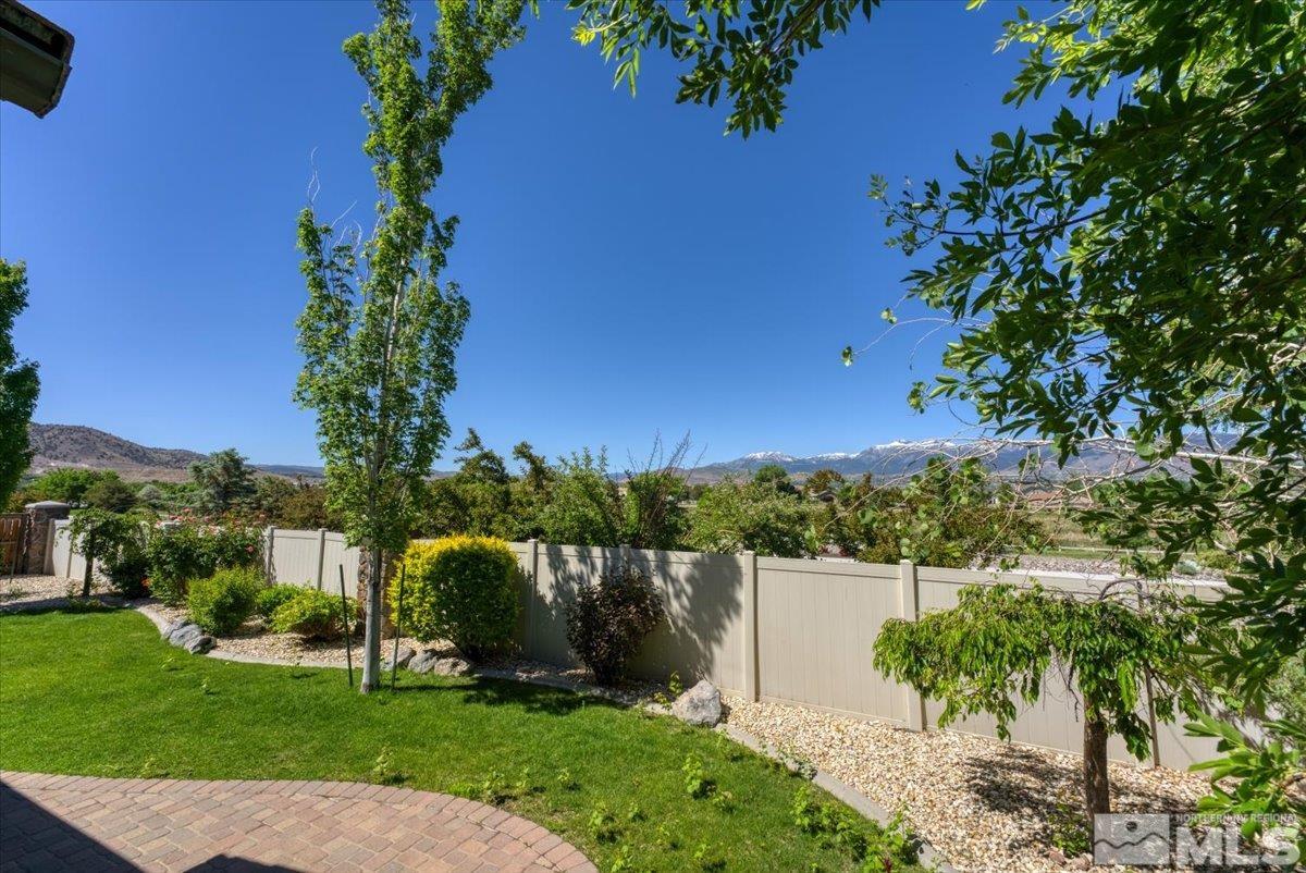10145 Burghley Lane Reno, NV 89521 - Photo 29 of 31 a view of a garden with a building in the background