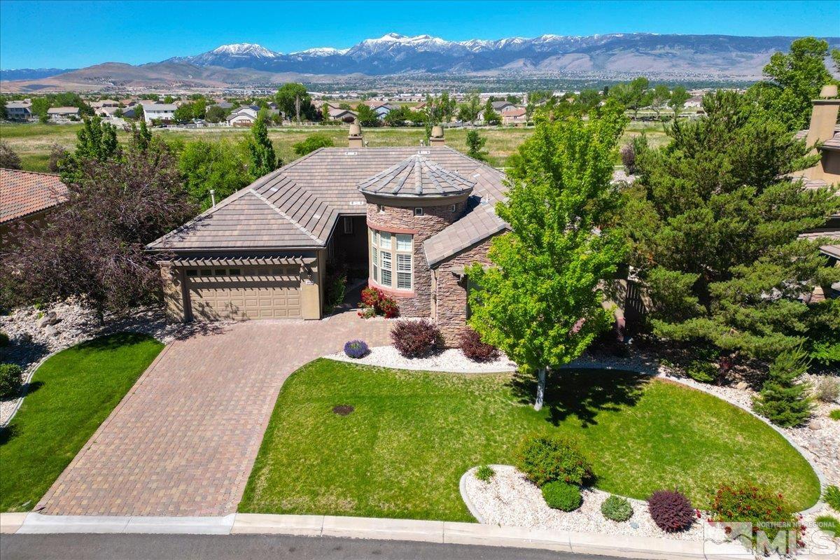 10145 Burghley Lane Reno, NV 89521 - Photo 3 of 31 a view of a house with a yard and sitting area