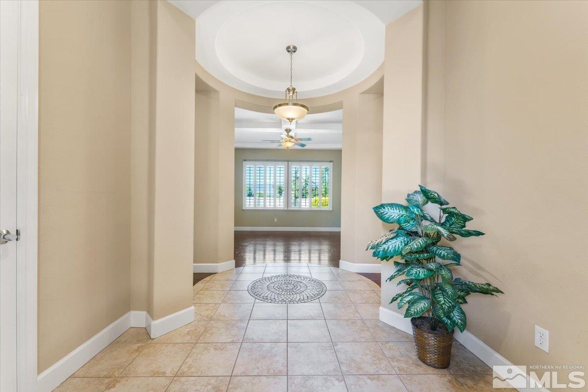 10145 Burghley Lane Reno, NV 89521 - Photo 6 of 31 a view of an entryway with a flower pot