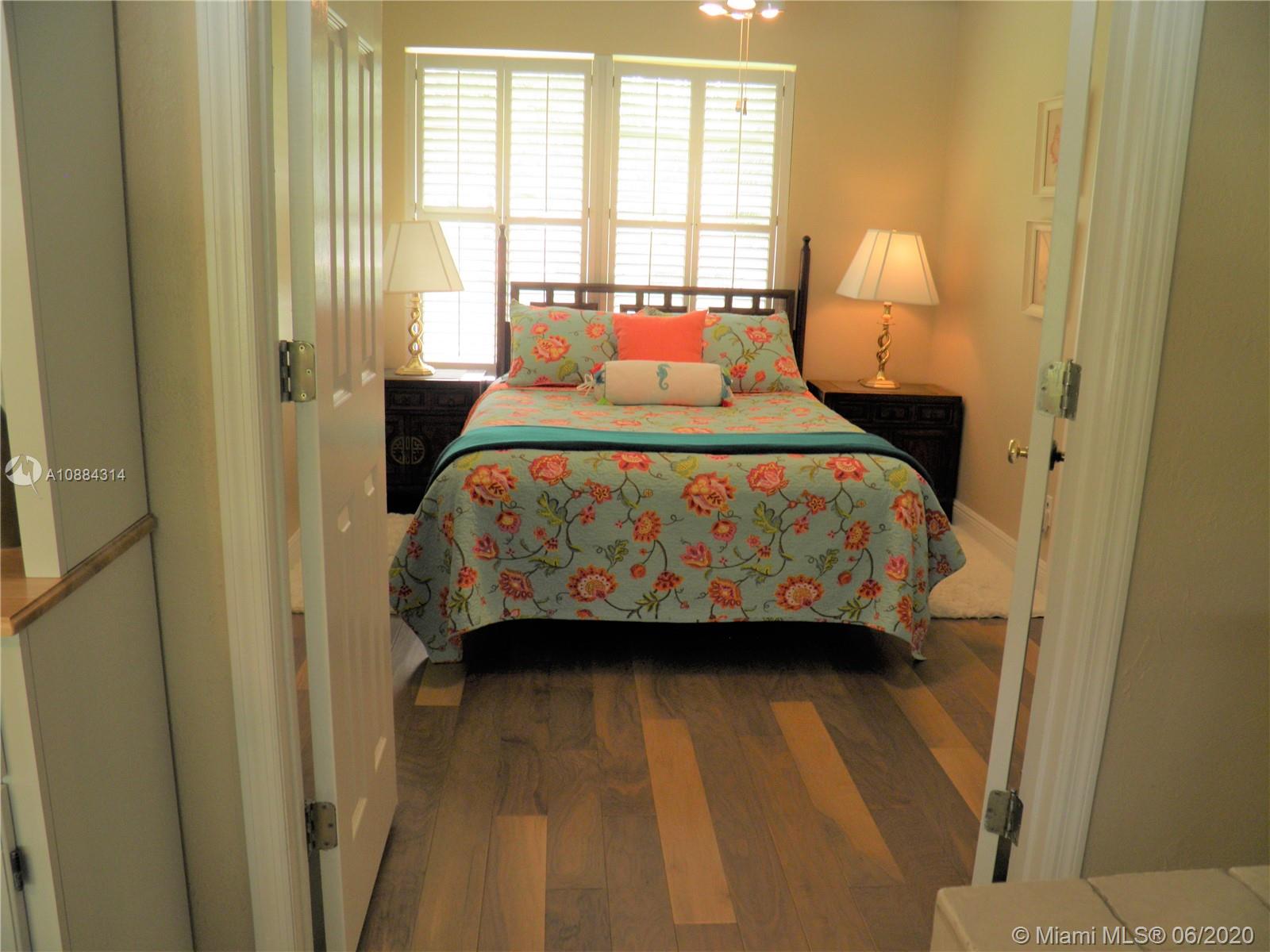 6311 Hancock Road Southwest Ranches, FL 33330 - Photo 13 of 23 a bedroom with a bed a window and potted plant