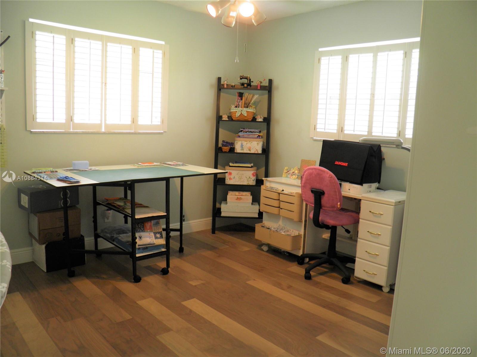 6311 Hancock Road Southwest Ranches, FL 33330 - Photo 15 of 23 a view of a workspace with furniture and a window