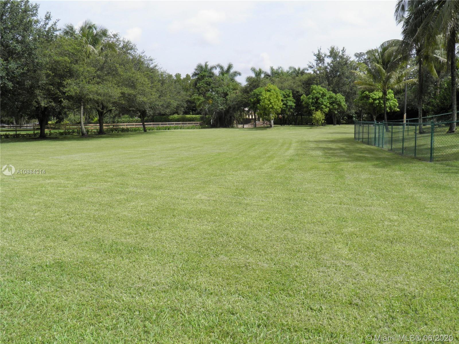 6311 Hancock Road Southwest Ranches, FL 33330 - Photo 5 of 23 a view of a field with trees in the background