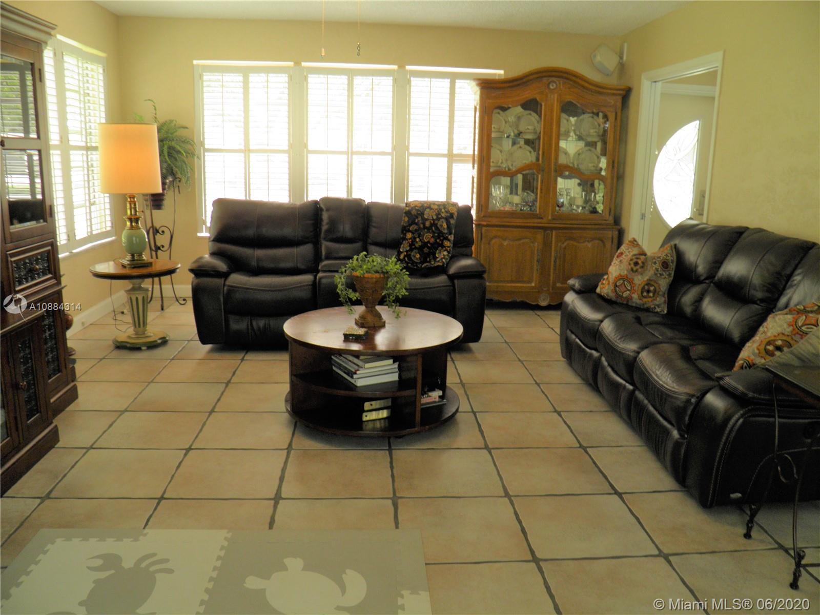 6311 Hancock Road Southwest Ranches, FL 33330 - Photo 7 of 23 a living room with furniture and a large window