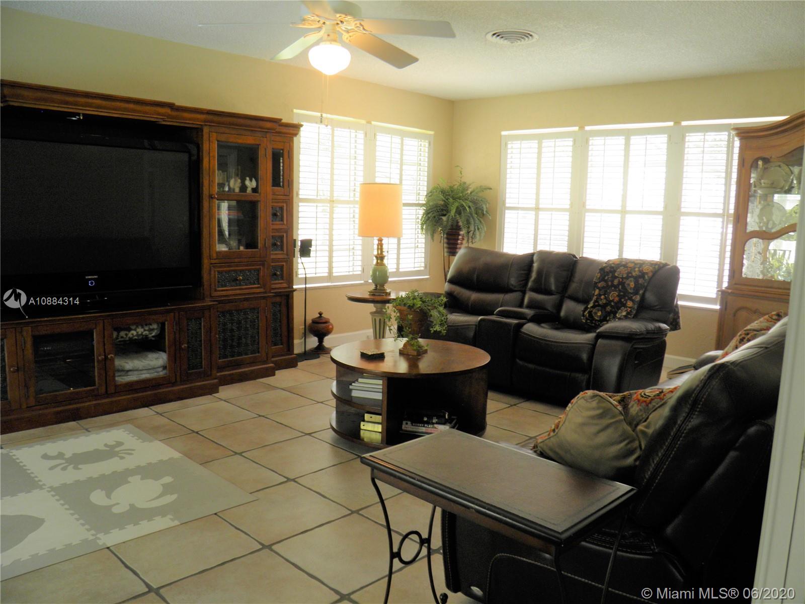 6311 Hancock Road Southwest Ranches, FL 33330 - Photo 8 of 23 a living room with furniture and a flat screen tv