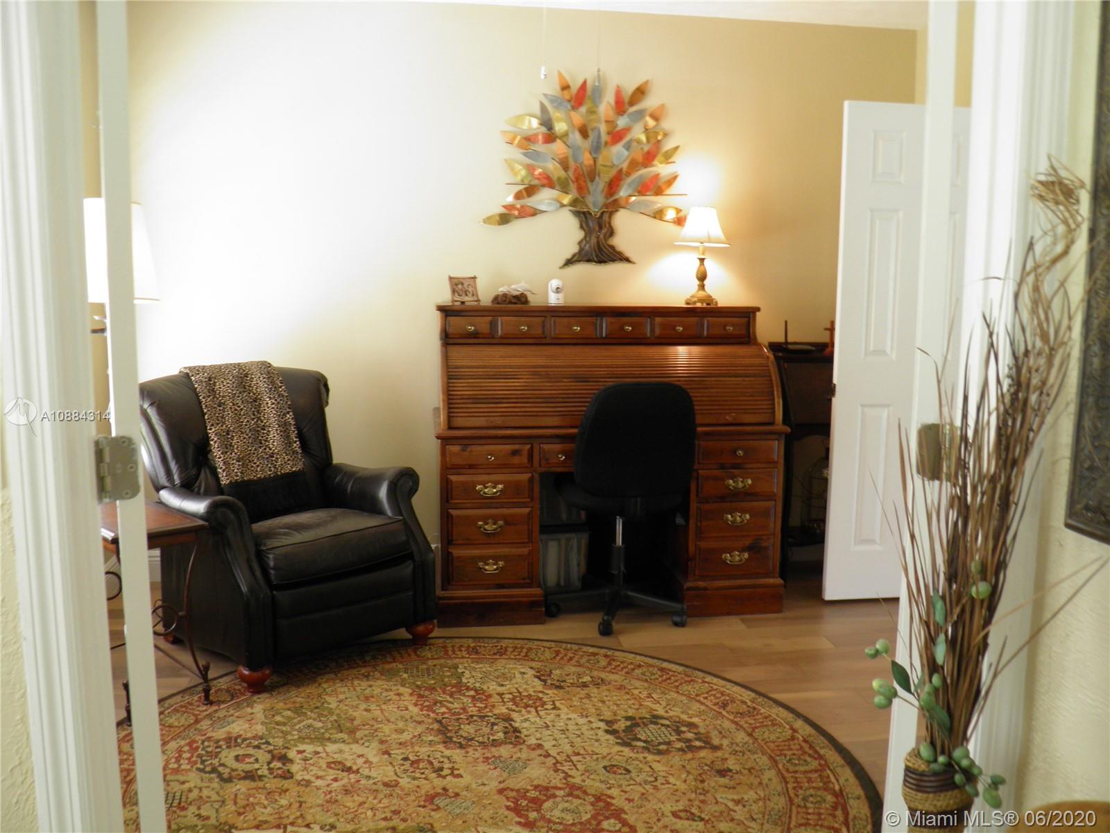 6311 Hancock Road Southwest Ranches, FL 33330 - Photo 10 of 23 a living room with furniture and a fireplace