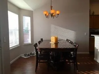 a kitchen with stainless steel appliances granite countertop a refrigerator a stove and a sink