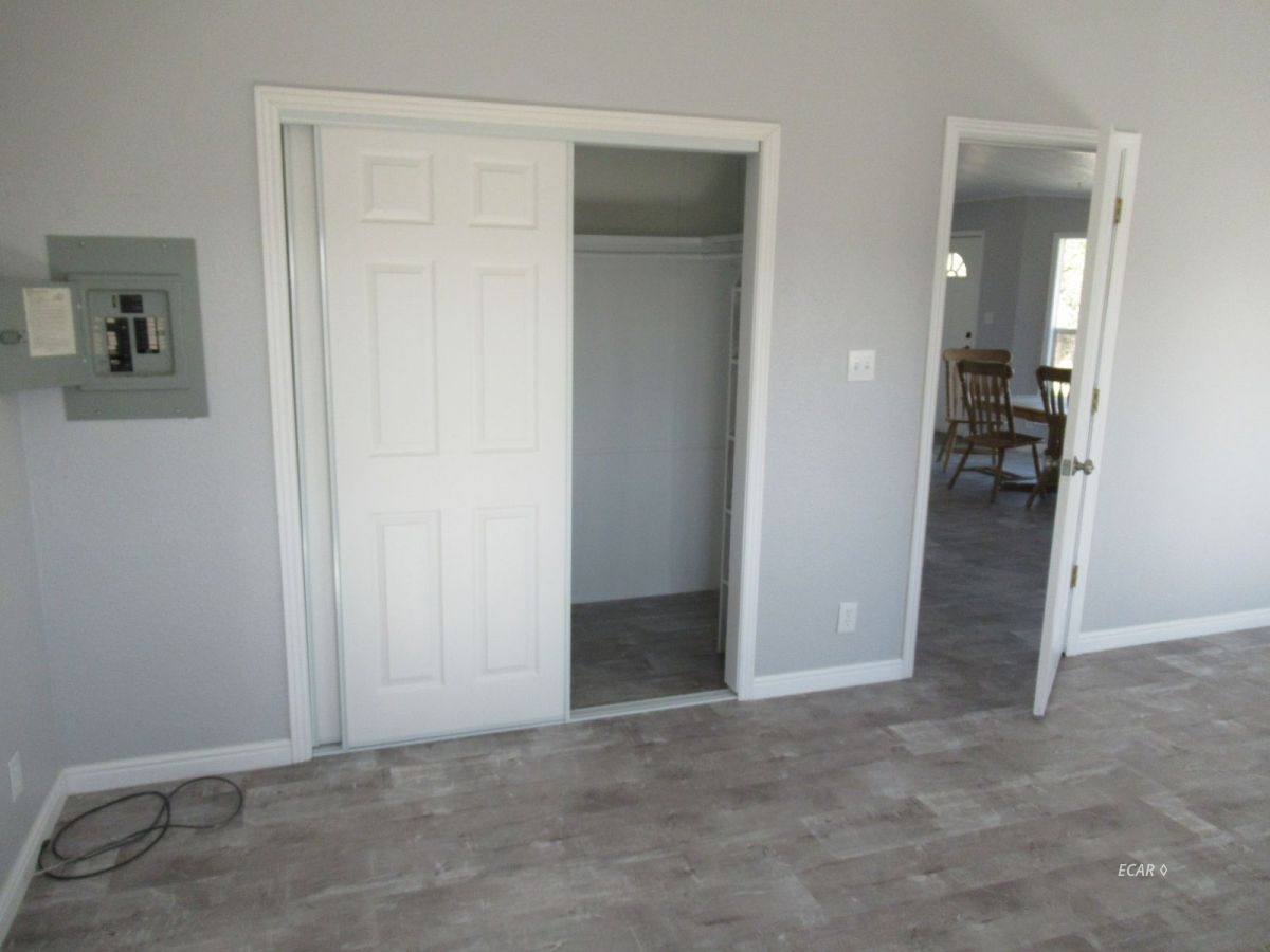 957 Spring Valley Parkway Spring Creek, NV 89815 - Photo 8 of 18 an empty room and closet area