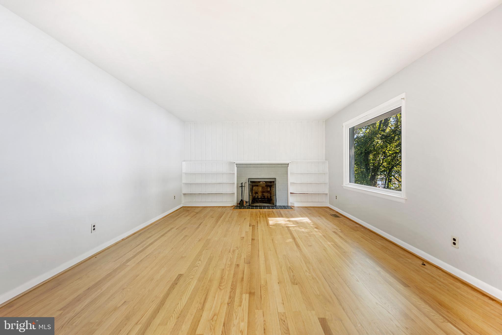 24564 Half Pone Point Road Hollywood, MD 20636 - Photo 4 of 27 Living Room with wood-burning FP