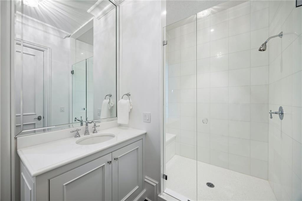 1640 Kenai Road Marietta, GA 30064 - Photo 15 of 43 a bathroom with a shower sink vanity granite and shower