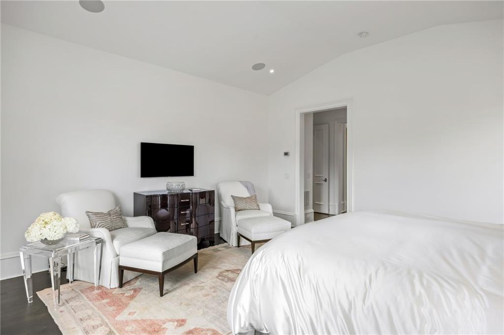 1640 Kenai Road Marietta, GA 30064 - Photo 19 of 43 a spacious bedroom with a bed and a flat screen tv