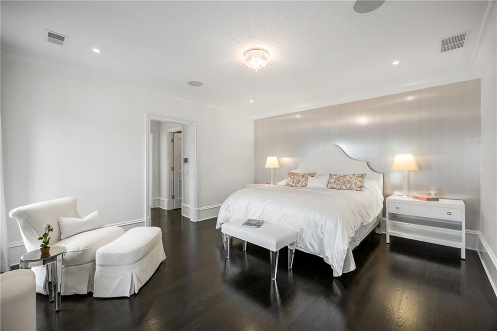 1640 Kenai Road Marietta, GA 30064 - Photo 25 of 43 a bedroom with a bed and a chandelier