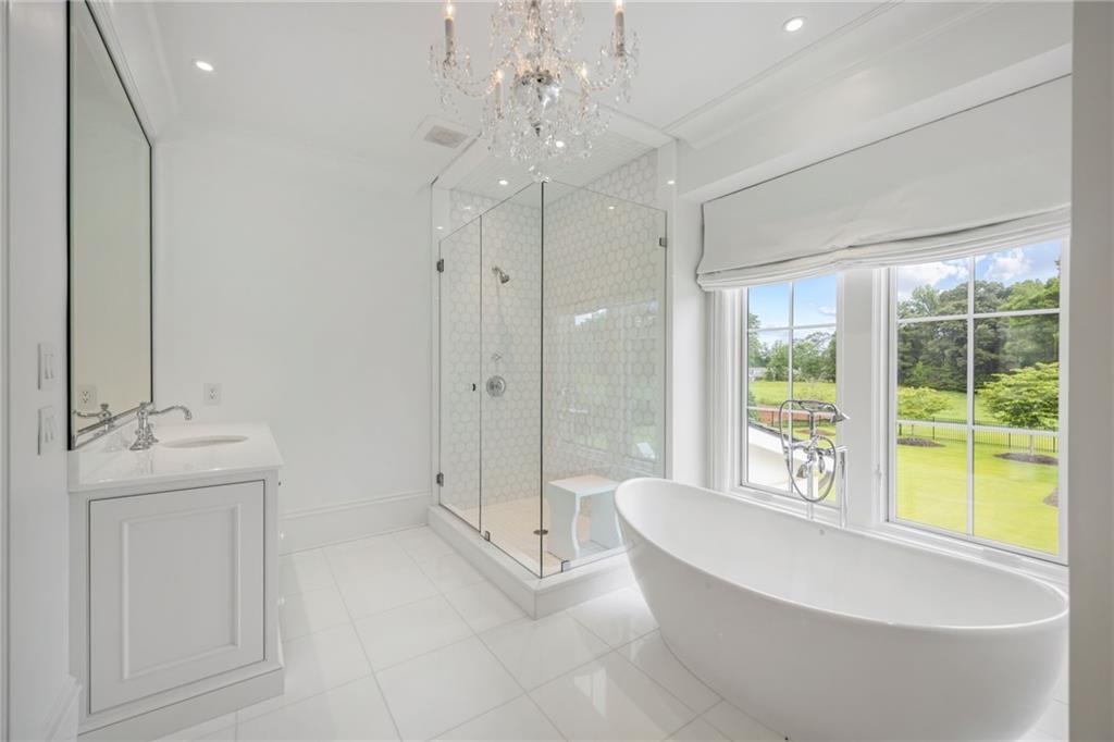 1640 Kenai Road Marietta, GA 30064 - Photo 26 of 43 a spacious bathroom with a tub shower and sink