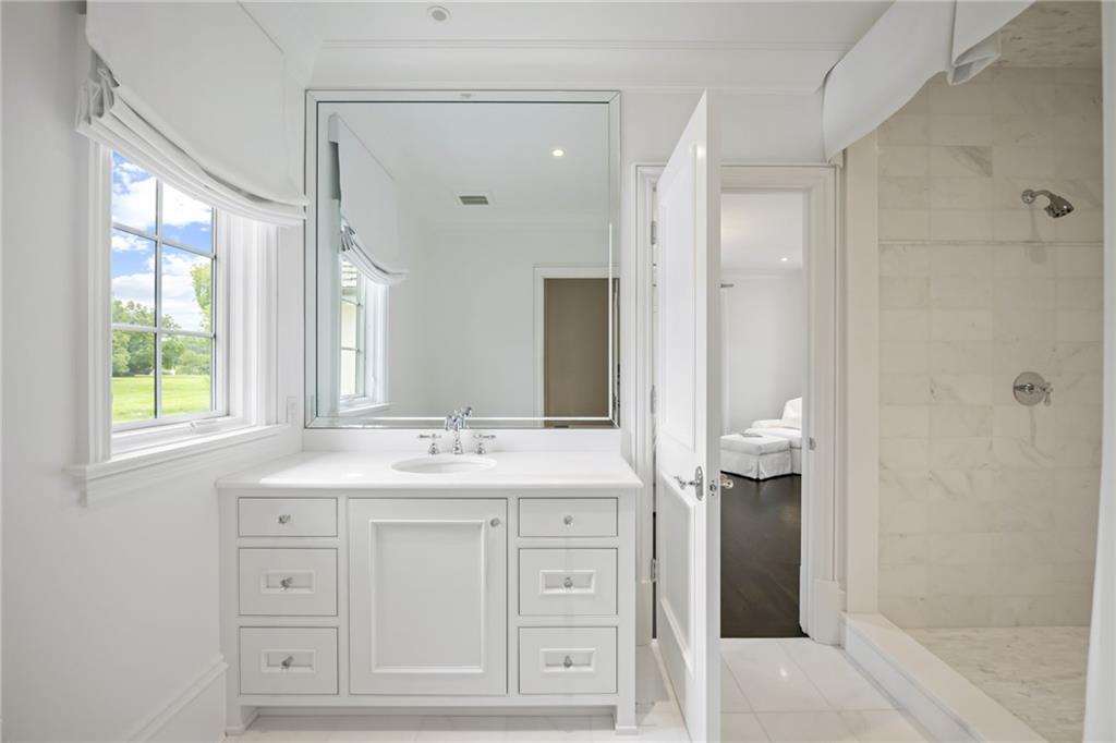 1640 Kenai Road Marietta, GA 30064 - Photo 32 of 43 a spacious bathroom with double sink and a mirror