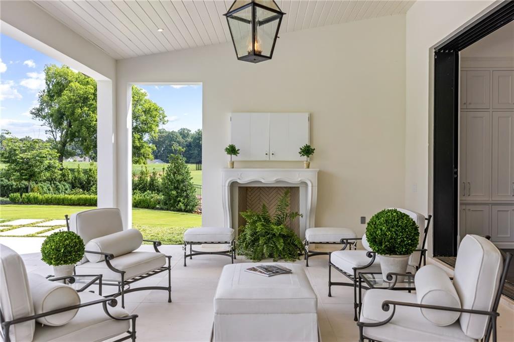 1640 Kenai Road Marietta, GA 30064 - Photo 38 of 43 a view of a patio with couches chairs and a yard