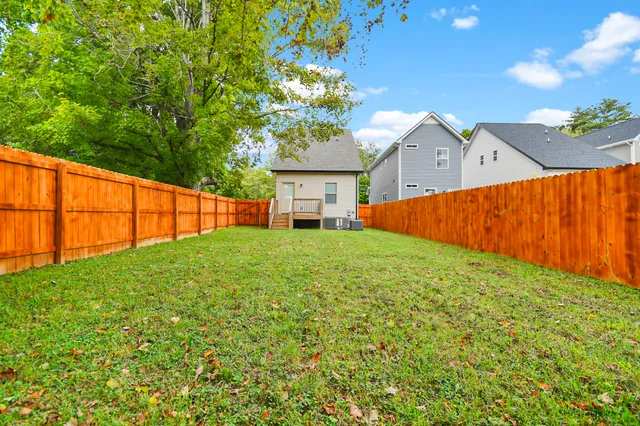 a view of a backyard with a garden and plants