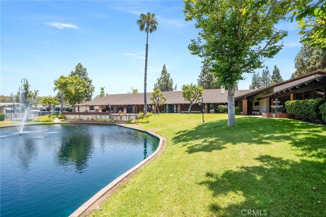 a view of a swimming pool with a yard