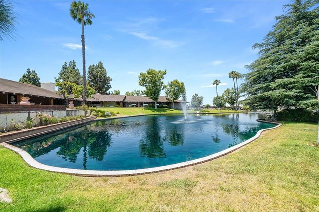 a view of a swimming pool with a lake view