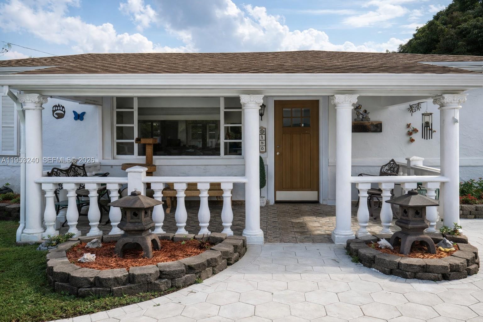 480 Northeast 109th Street Miami, FL 33161 - Photo 1 of 5 a front view of a house with sitting area