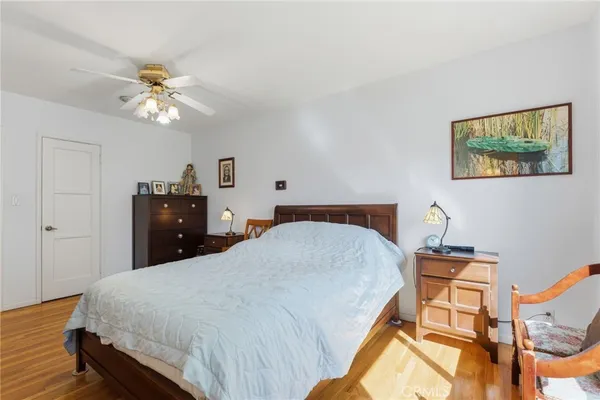 a bed room with a bed and a chandelier