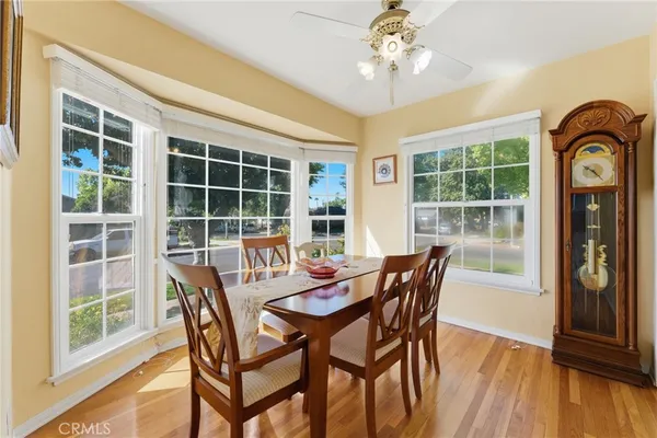a view of a dining room with furniture window and wooden floor
