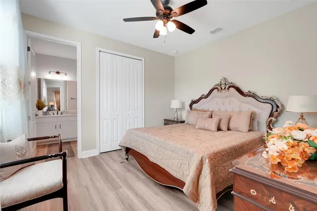 a view of a hallway with wooden floor and stairs