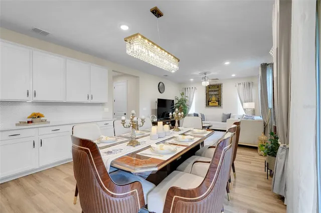a en suite bathroom with a granite countertop sink and a mirror