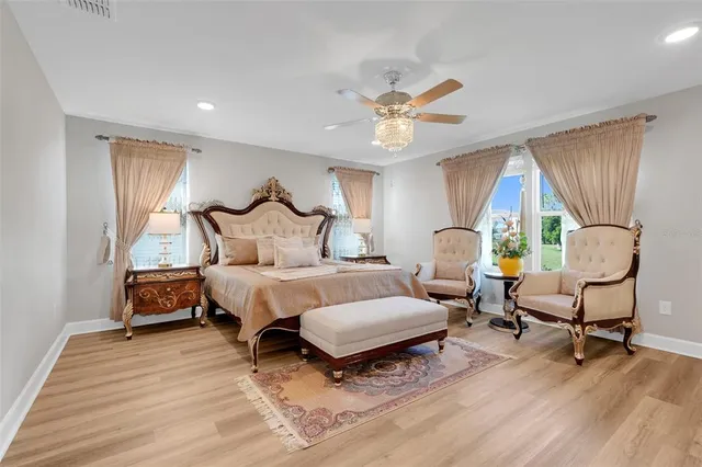 a view of a kitchen with white cabinets